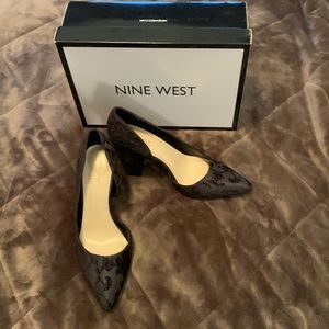 Women’s Nine West black patterned high heels. Good condition.